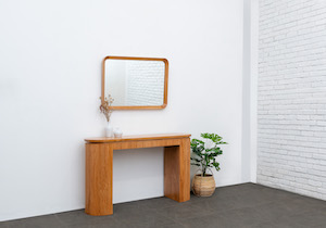 The Parkville collection is designed with a modern tropical feel in mind. The collection is exclusively done in Mindi / White Cedar wood, which is still part of the mahogany family. The natural finish of the wood and the unique design will simply bring an airy ambience to your space.
<br><b>On Frame:</b>
<br>Console Table - Size: 140x40x80H cm
<br>Mirror - Size: 90W x 60H cm.
